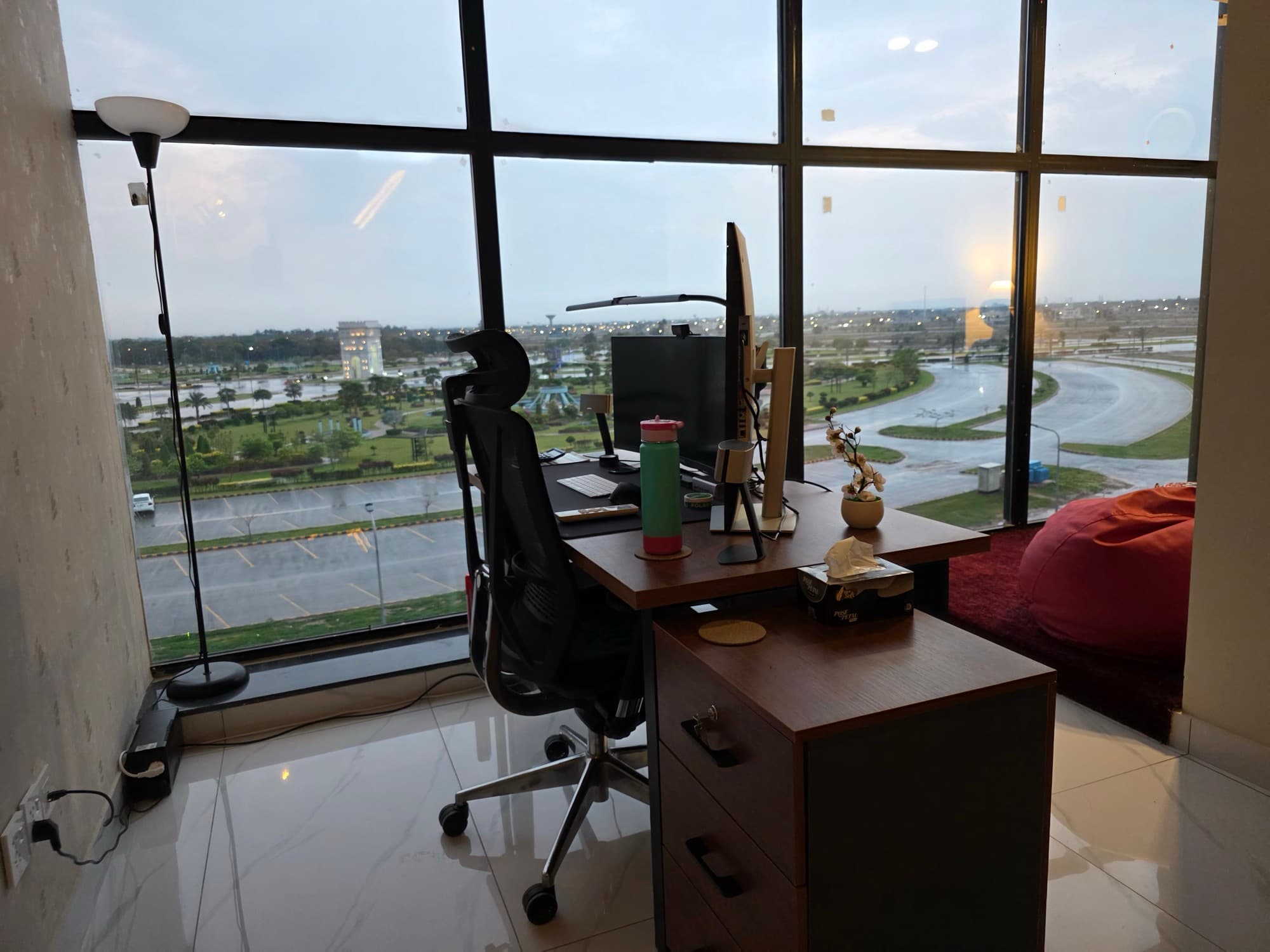 A ByteTuned desk by a floor-to-ceiling window overlooking the city